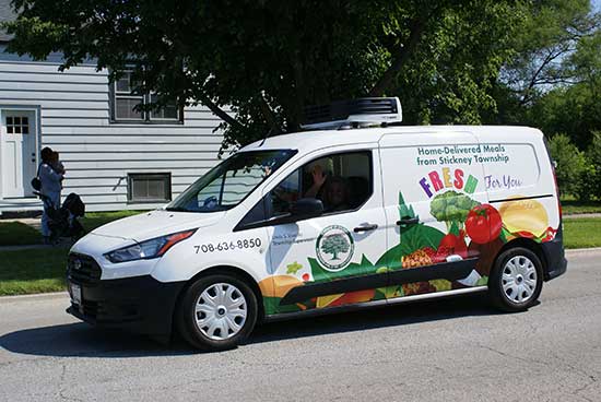 Homebound Meal Delivery truck participates in the Forest View Pet Parade